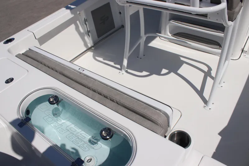 Slide: The Image of 2025 Sea Pro 222 boat interior with seating and storage compartments. - 21