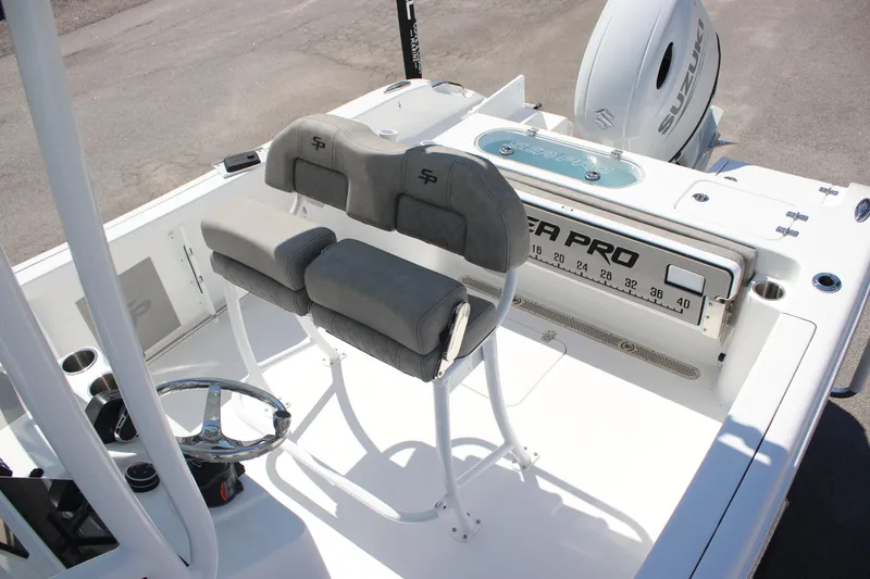 Slide: The Image of 2025 Sea Pro 222 boat interior with dual seats and steering wheel. - 23