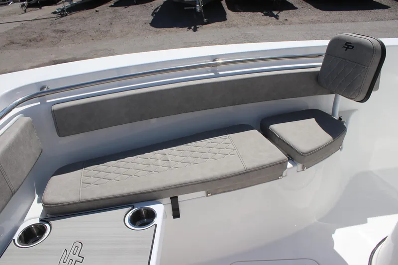 Slide: The Image of 2025 Sea Pro 222 boat interior with gray cushioned seating and cup holders. - 25
