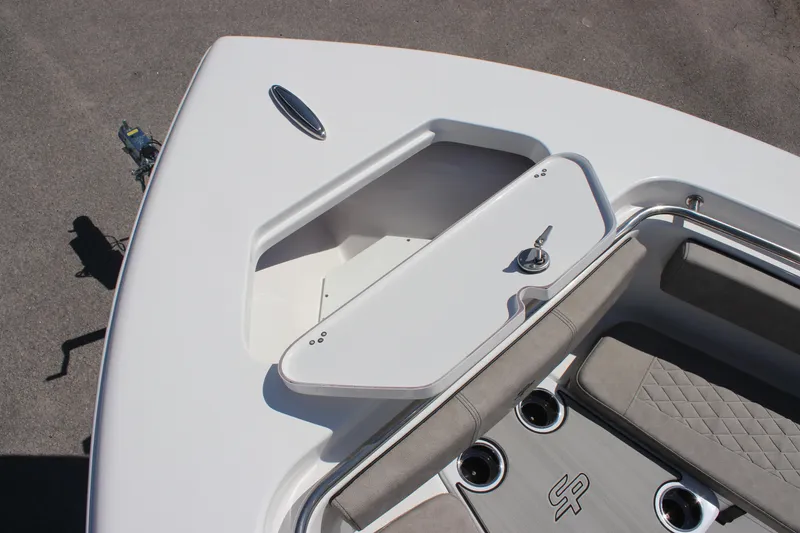 Slide: The Image of 2025 Sea Pro 222 boat bow with storage compartment and seating area. - 26