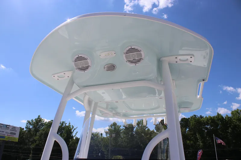 Slide: The Image of 2025 Sea Pro 222 boat T-top with speakers against a clear blue sky. - 27