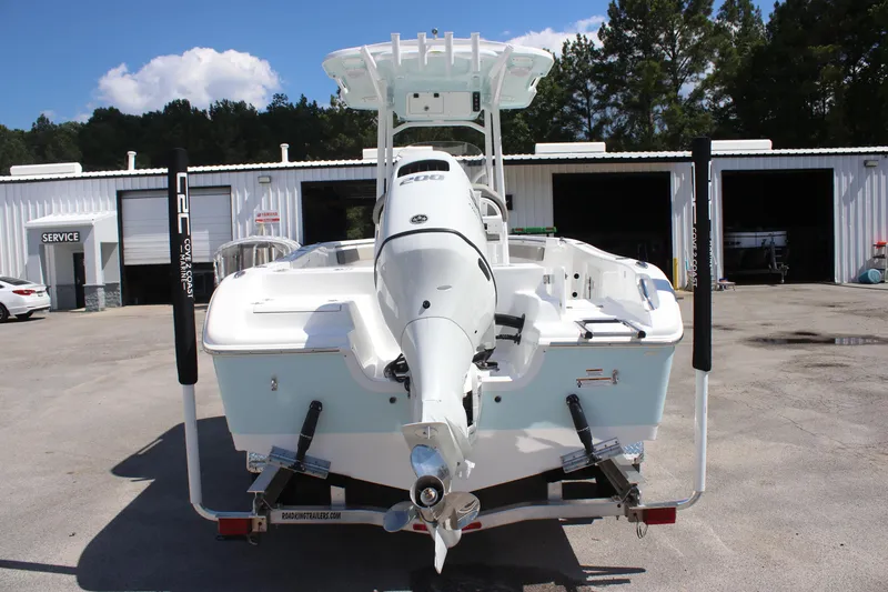 Slide: The Image of 2025 Sea Pro 222 boat, rear view, parked at a service facility. - 4