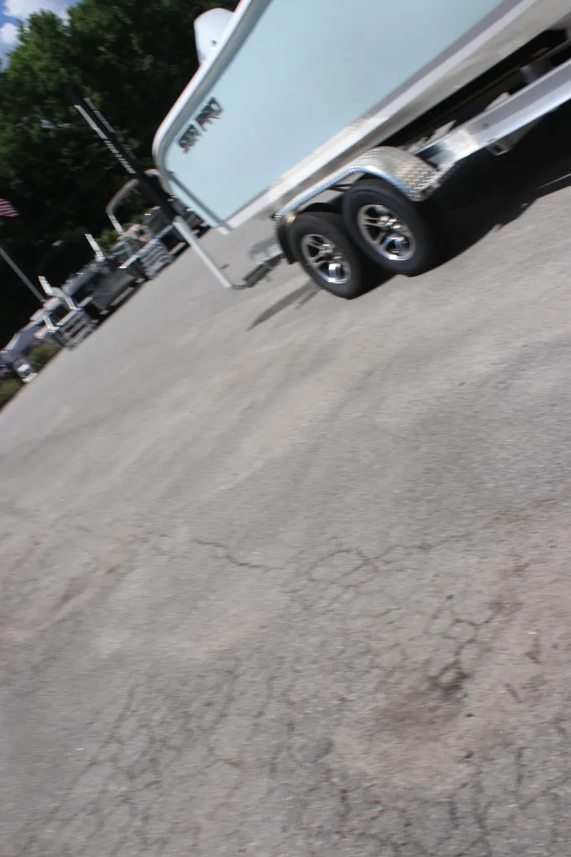 Slide: The Image of 2025 Sea Pro 222 boat on trailer in parking lot, side view. - 6