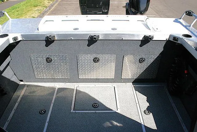 Slide: The Image of 2023 Thunder Jet 185 Luxor boat interior with storage compartments and aluminum finish. - 12