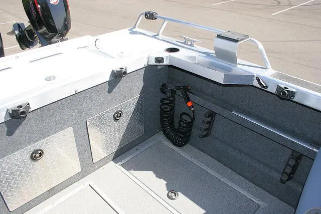 Slide: The Image of 2023 Thunder Jet 185 Luxor boat interior with storage compartments and coiled cable. - 13