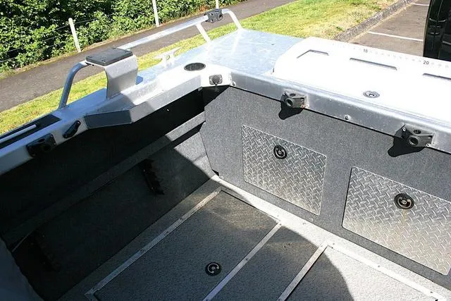 Slide: The Image of 2023 Thunder Jet 185 Luxor boat interior with storage compartments and seating area. - 14