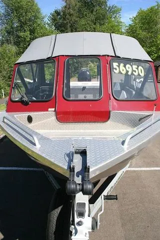 Slide: The Image of 2023 Thunder Jet 185 Luxor boat with red cabin, displayed outdoors. - 15
