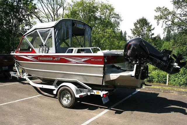 Slide: The Image of 2023 Thunder Jet 185 Luxor boat on trailer, parked outdoors. - 3
