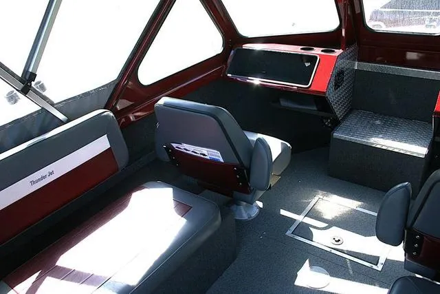 Slide: The Image of Interior of 2023 Thunder Jet 185 Luxor boat, featuring seating and dashboard. - 8