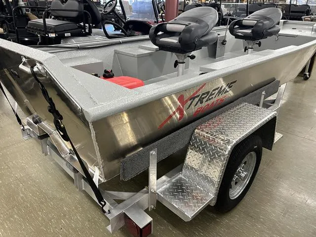 Slide: The Image of 2025 XTREME BOATS 1542Ss Tunnel, aluminum fishing boat on trailer, showroom display. - 3