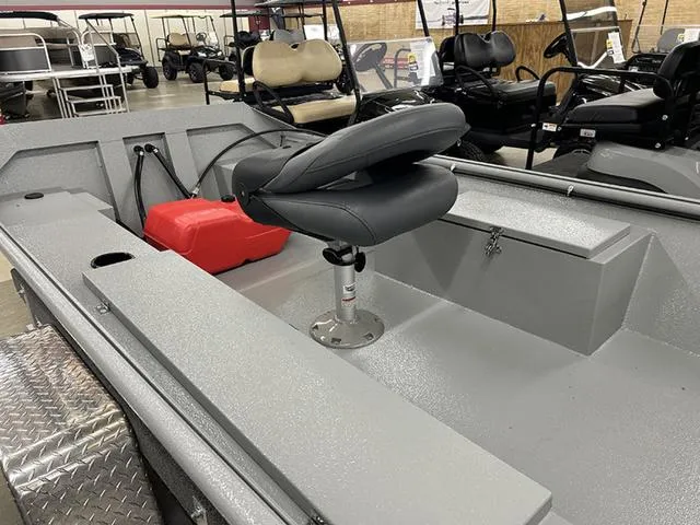 Slide: The Image of 2025 XTREME BOATS 1542Ss Tunnel with gray interior and swivel seat in showroom. - 4