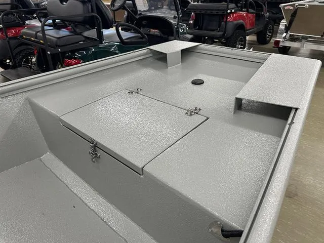 Slide: The Image of 2025 XTREME BOATS 1542Ss Tunnel interior with storage compartments and seating. - 5