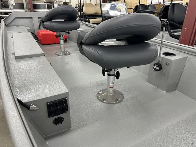 Slide: The Image of 2025 XTREME BOATS 1542Ss Tunnel interior with swivel seats and storage compartments. - 6