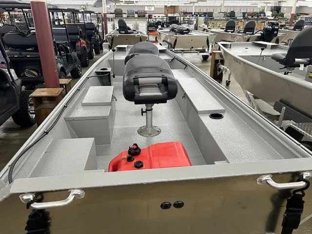 Slide: The Image of 2025 XTREME BOATS 1542Ss Tunnel, interior view, featuring seating and storage compartments. - 7