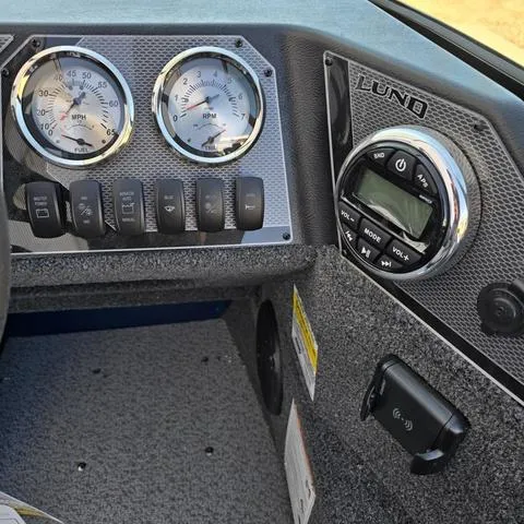 Slide: The Image of Dashboard of 2025 Lund 1775 Adventure Sport boat with gauges and controls. - 10