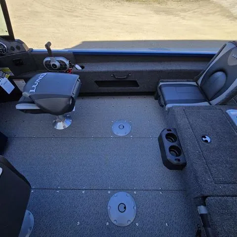 Slide: The Image of 2025 Lund 1775 Adventure Sport boat interior with seating and storage compartments. - 11