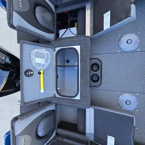 Slide: The Image of 2025 Lund 1775 Adventure Sport boat interior with storage compartments and equipment. - 12