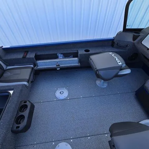 Slide: The Image of 2025 Lund 1775 Adventure Sport boat interior with seating and storage compartments. - 13