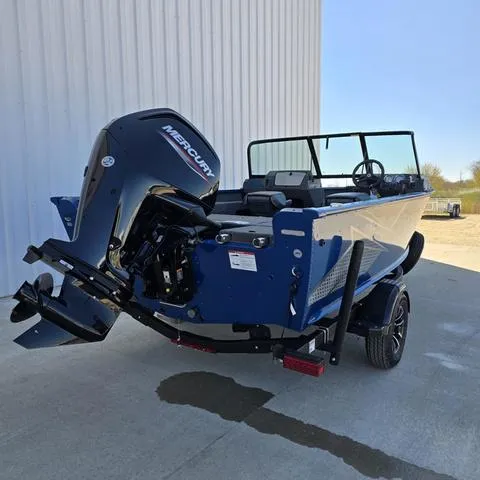 Slide: The Image of 2025 Lund 1775 Adventure Sport boat with Mercury outboard motor, parked outdoors. - 4