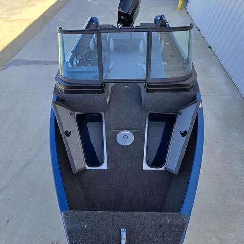 Slide: The Image of 2025 Lund 1775 Adventure Sport boat, top view, open storage compartments, sleek design. - 7