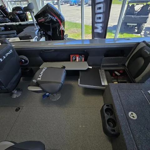 Slide: The Image of 2024 Lund 2075 Tyee boat interior with seating and storage compartments. - 10
