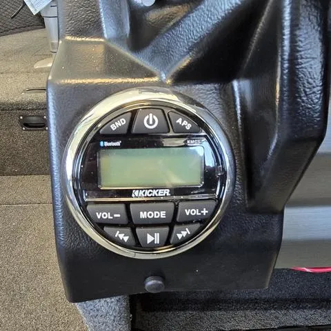 Slide: The Image of 2024 Lund 2075 Tyee boat featuring a Kicker audio system control panel. - 7