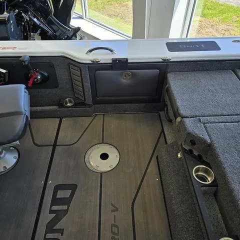Slide: The Image of 2024 Lund 1875 Pro V Sport boat interior with seating and storage compartments. - 10