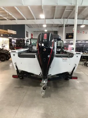 Slide: The Image of 2024 Lund 1875 Pro V Sport boat with powerful outboard motor in showroom. - 3