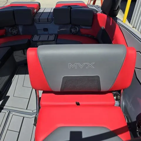 Slide: The Image of 2024 Starcraft MVX IO SURF boat interior with red and gray seating. - 12