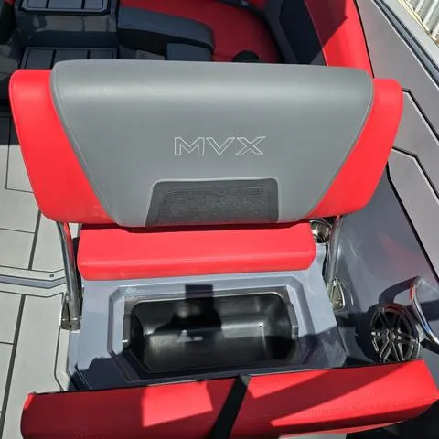 Slide: The Image of 2024 Starcraft MVX IO SURF boat seat with red and gray upholstery. - 13