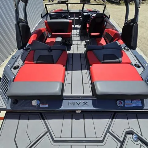 Slide: The Image of 2024 Starcraft MVX IO SURF boat with red and gray seating, interior view. - 16
