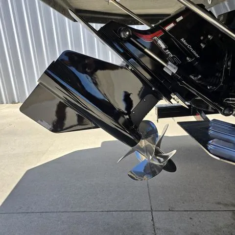 Slide: The Image of 2024 Starcraft MVX IO SURF boat propeller and outdrive detail. - 5