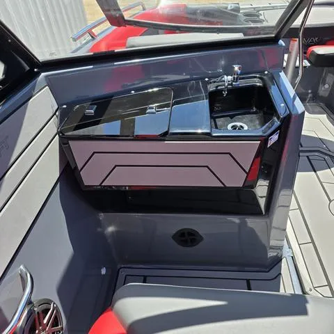 Slide: The Image of 2024 Starcraft MVX IO SURF boat interior with sleek sink and modern design. - 9