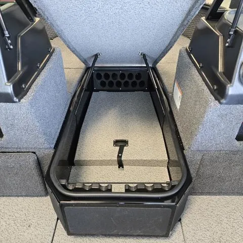 Slide: The Image of 2025 Lund 1875 Impact XS boat interior storage compartment with open lid and organized layout. - 7