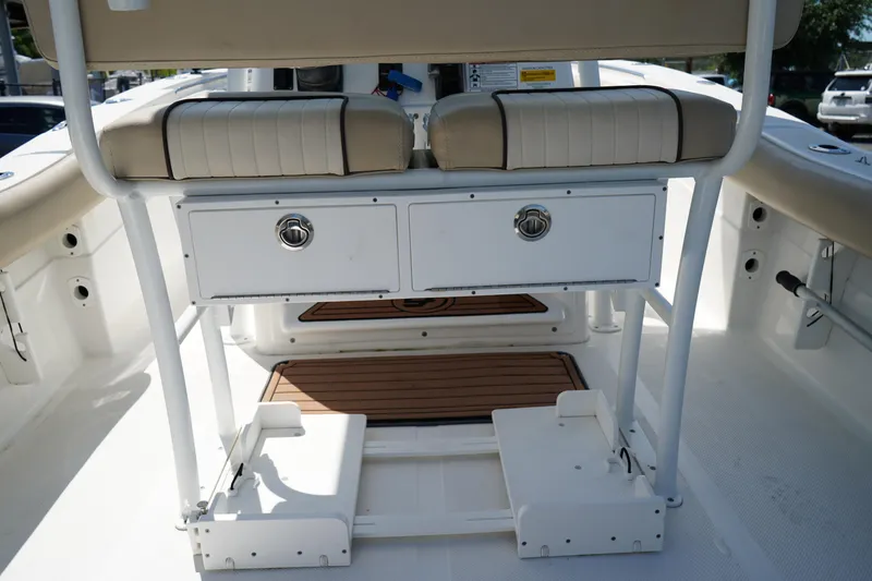 Slide: The Image of 2016 Sea Fox 246 Commander boat interior with seating and storage compartments. - 12