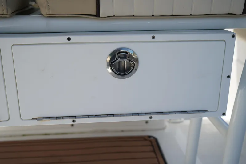 Slide: The Image of 2016 Sea Fox 246 Commander storage compartment with stainless steel handle. - 14