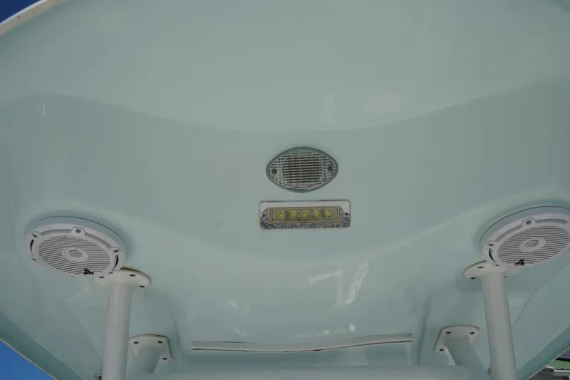 Slide: The Image of 2016 Sea Fox 246 Commander boat speakers and light on the underside of the T-top. - 18