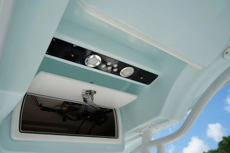 Slide: The Image of 2016 Sea Fox 246 Commander boat console with storage compartment and control panel. - 19