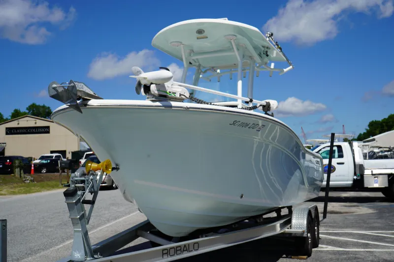Slide: The Image of 2016 Sea Fox 246 Commander boat on trailer under clear blue sky. - 2