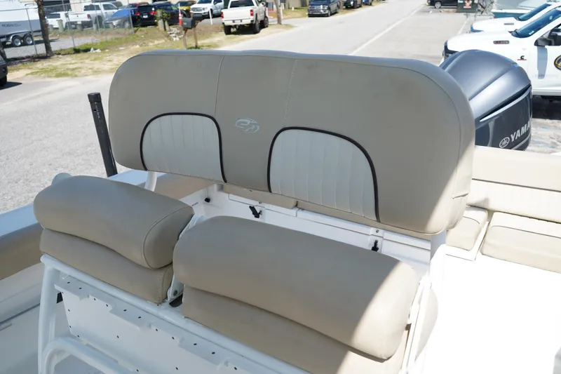 Slide: The Image of 2016 Sea Fox 246 Commander boat seating with beige cushions and Yamaha engine in background. - 21