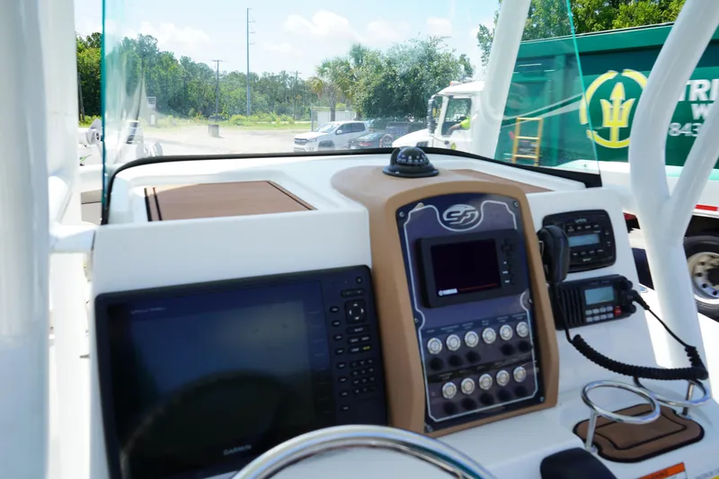 Slide: The Image of 2016 Sea Fox 246 Commander boat dashboard with navigation controls and display screens. - 25