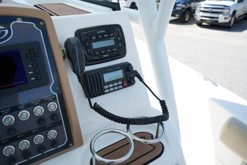 Slide: The Image of Control panel of 2016 Sea Fox 246 Commander boat with radio and cup holders. - 27