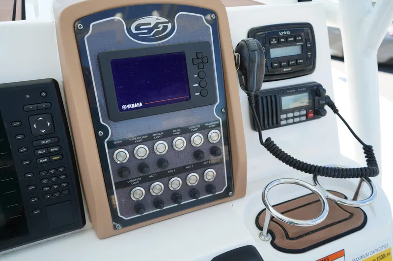 Slide: The Image of 2016 Sea Fox 246 Commander dashboard with Yamaha controls and communication devices. - 28