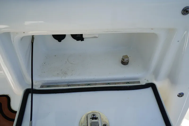 Slide: The Image of 2016 Sea Fox 246 Commander boat compartment with visible wiring and fittings. - 33