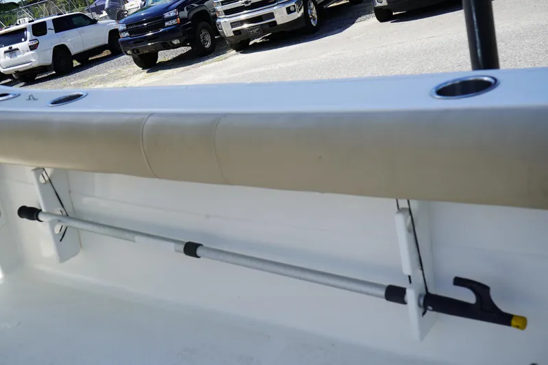 Slide: The Image of 2016 Sea Fox 246 Commander boat interior with rod holder and beige seating. - 35