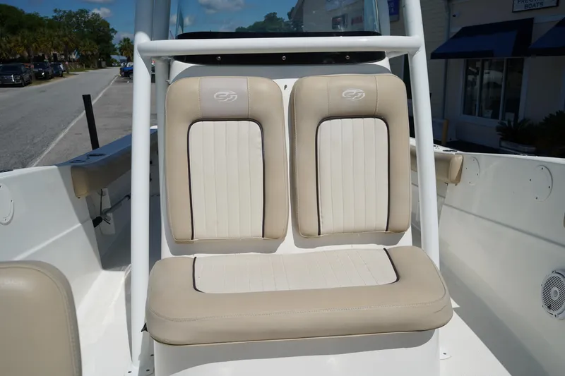 Slide: The Image of 2016 Sea Fox 246 Commander boat seats, beige and white, on a sunny day. - 38