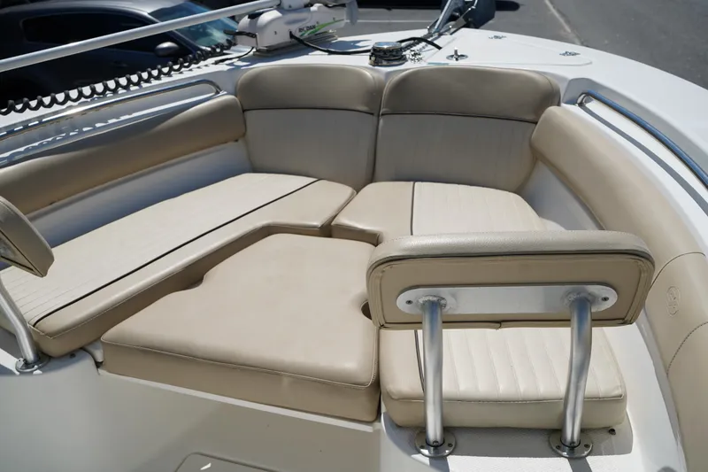 Slide: The Image of 2016 Sea Fox 246 Commander boat with beige cushioned seating area. - 40
