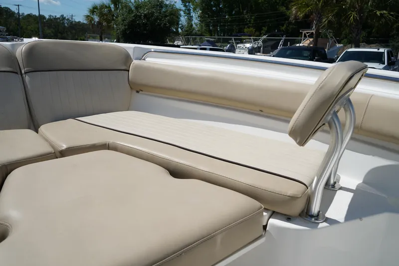 Slide: The Image of 2016 Sea Fox 246 Commander boat with beige cushioned seating in the bow area. - 42