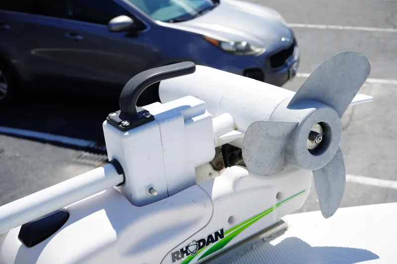 Slide: The Image of Rhodan trolling motor on 2016 Sea Fox 246 Commander boat, parked near a gray car. - 46