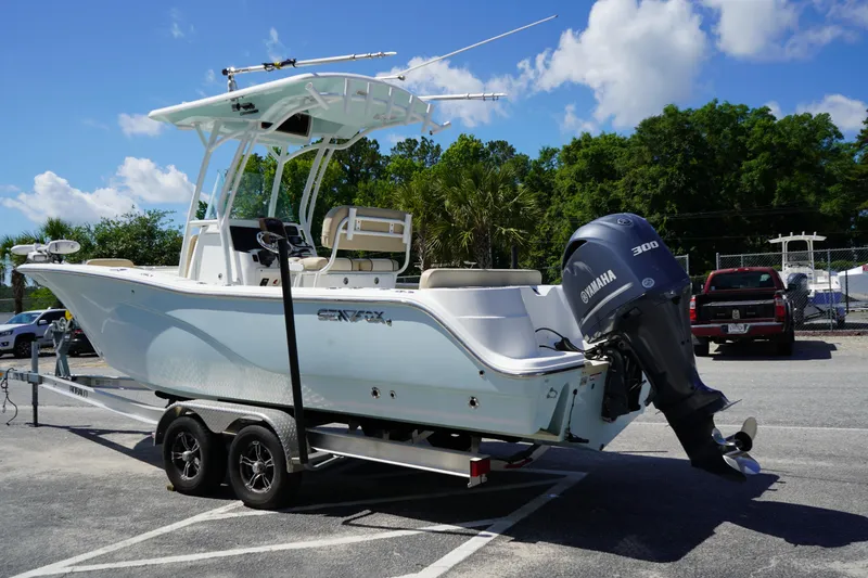 Slide: The Image of 2016 Sea Fox 246 Commander boat on trailer with Yamaha 300 engine, parked outdoors. - 5